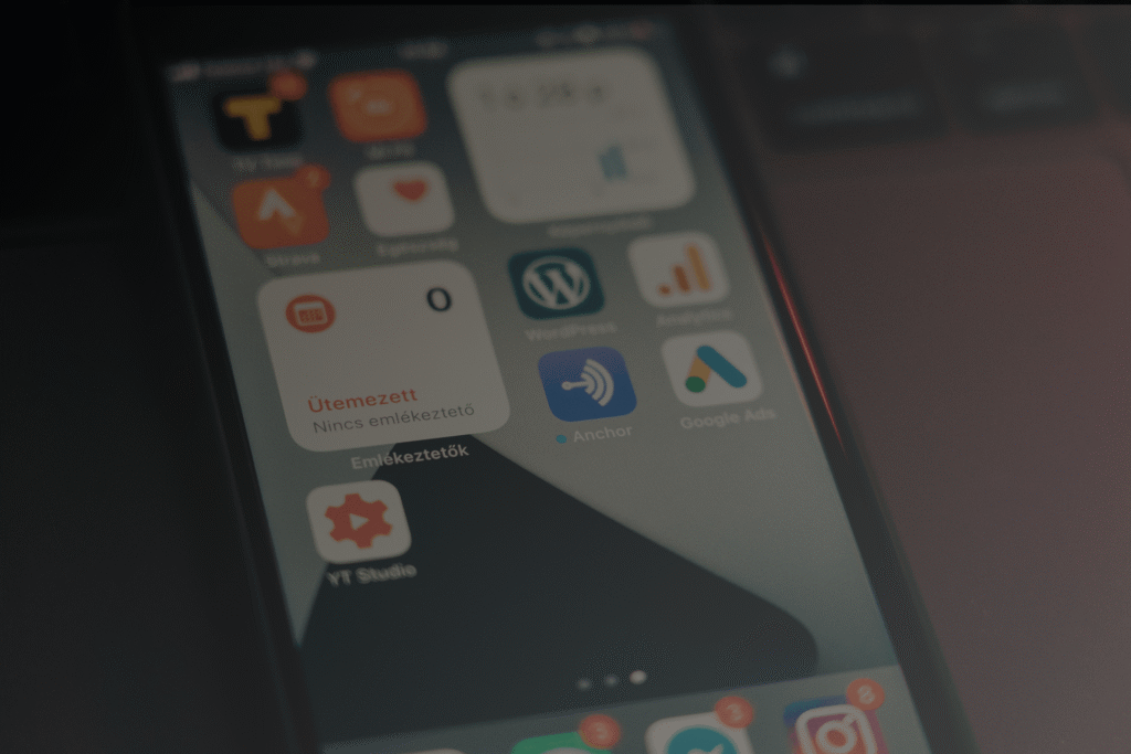 Smartphone displaying a collection of mobile applications representing cross-platform app development.